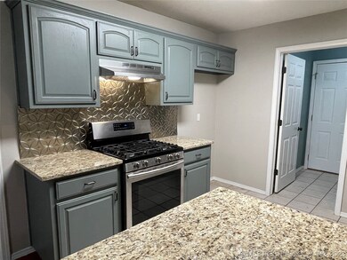 gas stove, new granite counters, & backsplash.