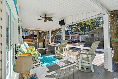 Deck featuring ceiling fan and a grill