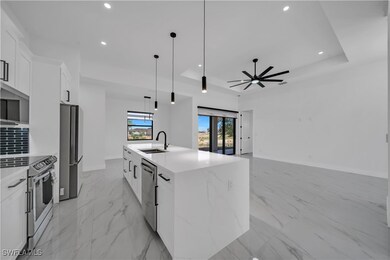 Kitchen with a sink, appliances with stainless ste