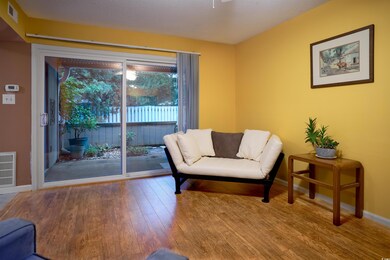 Sitting room with wood-type flooring and a texture