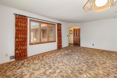 Floor panels with an area rug would open this room up even more