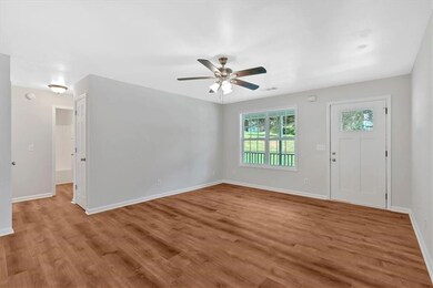 Family room with secondary bedroom and bath hallway