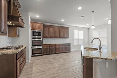 Spacious Kitchen with large bar area, double oven,
