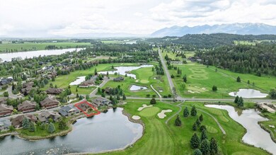 Aerial view of property's location featuring property boundaries highlighted, a water and mountain view, and nearby suburban area