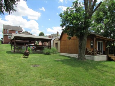 Huge back yard with pool, pool house and picnic pa
