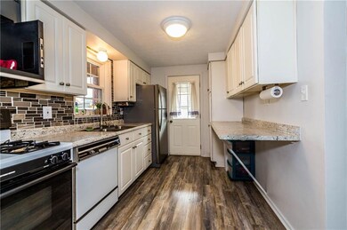 NEW laminate flooring, NEW counter top, NEW tile b