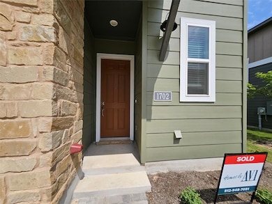 Entrance to property with stone siding