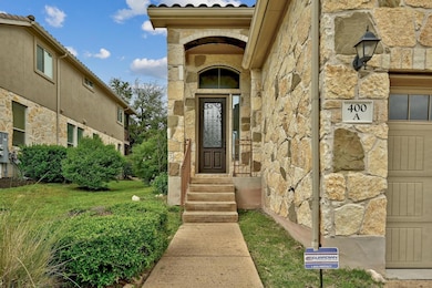 Doorway to property with stone siding