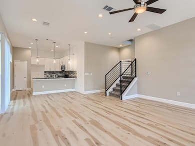 Unfurnished living room featuring visible vents, 