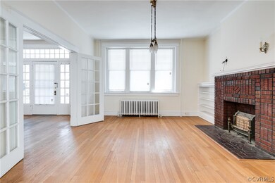 Main entrance to home into large foyer.  French doors from foyer open into large living room.