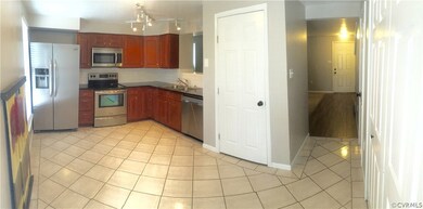 Another view of the kitchen opening up to foyer an