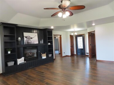 Living room featuring wood look tiled flooring.
