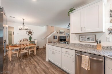 Kitchen featuring stainless steel dishwasher, whit
