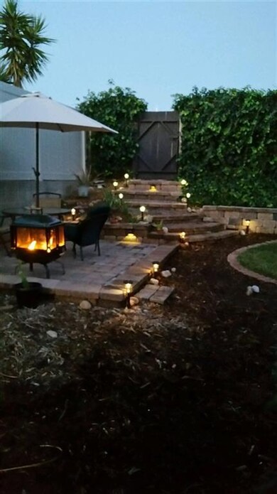 Delightful pathway lights brighten the private bac
