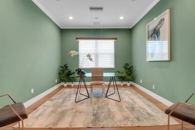 Home office featuring baseboards and wood finished floors