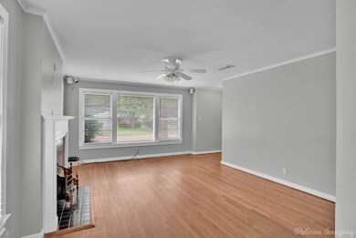 Unfurnished living room featuring ornamental moldi