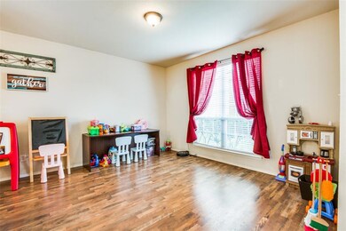The first of two living areas overlooks the front yard and features large window providing gorgeous light to the room. Oversized space can be used for anything your family needs from playroom to formal living room.