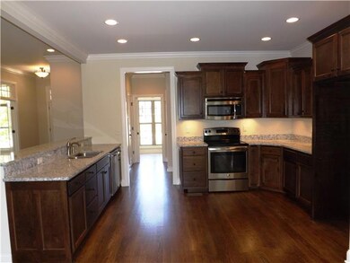 This is another view of the kitchen highlighting the raised bar that opens to the great room. 
