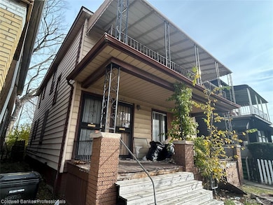 View of side of home featuring a porch