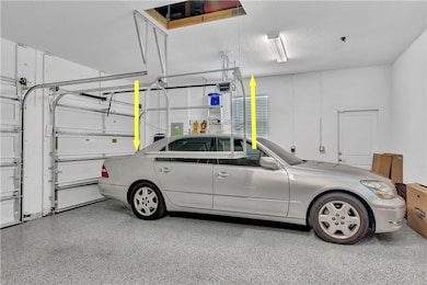 A Versa-Lift is a motorized attic lift system that safely raises & lowers storage items to the attic with the push of a button.