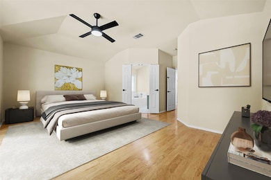 Bedroom with light wood-style floors, vaulted cei