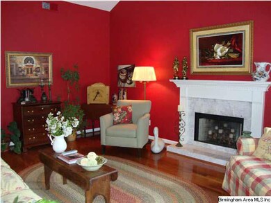 Vaulted ceiling, hardwood flooring and fireplace i
