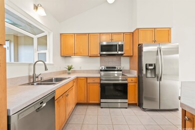 Light and bright with vaulted ceilings, a skylight, and a spacious pantry for extra convenience.