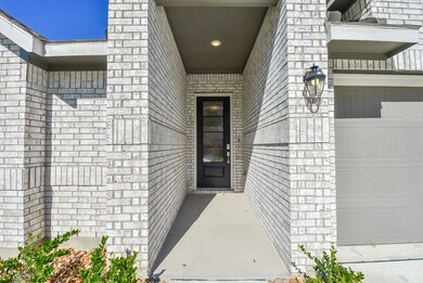 Welcoming front entrance of this all brick home.