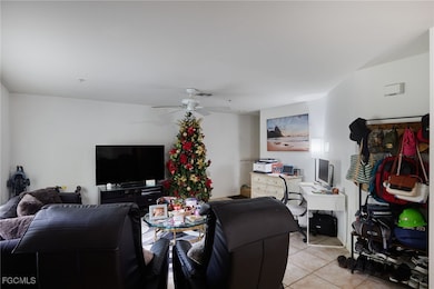 Living area with light tile patterned flooring and