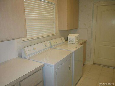 Spacious Laundry room has lot of storage space