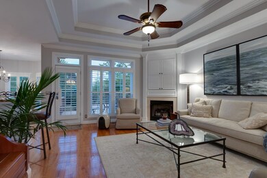 Tray ceilings and gas fireplace make this family room elegant and cozy.