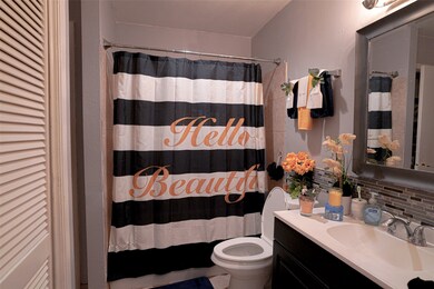 Bathroom has been updated with a newer vanity, and