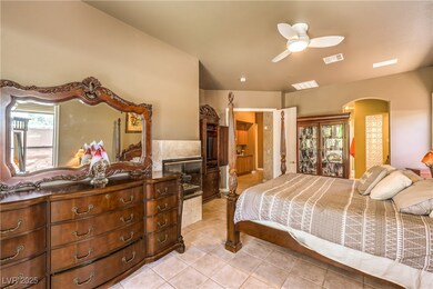Bedroom featuring arched walkways, light tile patt