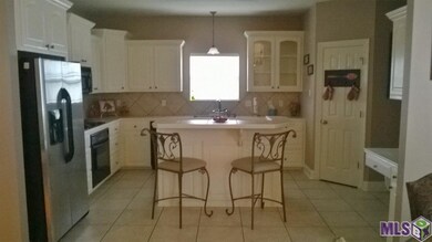 Kitchen with lots of cabinets, center island with 