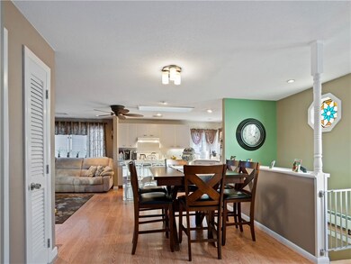 From hallway facing dining area, kitchen and livin