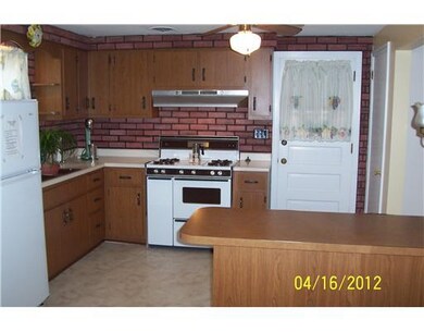 Kitchen. Easy Access to Side Porch From Kitchen