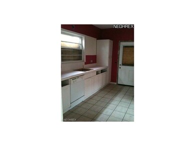 Kitchen with tile floor.