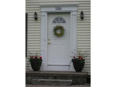 Exterior Front. Welcoming front door adds warmth t