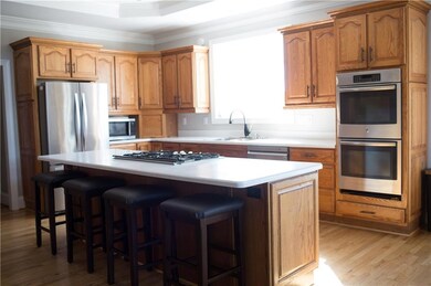 Kitchen with light hardwood / wood-style floors, s