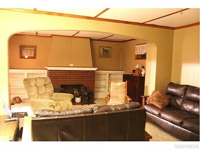 Living Room. VIEW OF THE FIREPLACE IN THE LIVING R
