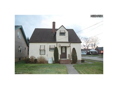 Back Of House Leads To 2 Car Garage & Covered Patio