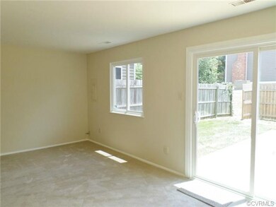 Family room with new carpet, new doors, windows an