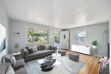 Virtually staged, so much room in this freshened up living room.