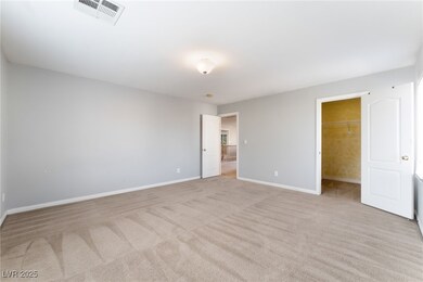Unfurnished bedroom featuring a walk in closet, vi