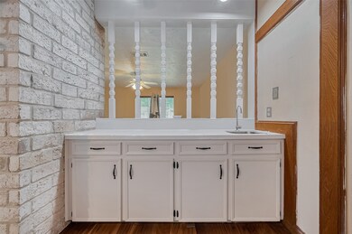 Charming built-in bar area with open spindle divid