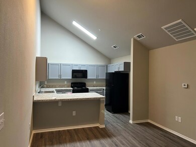 Kitchen with black appliances, kitchen peninsula, 