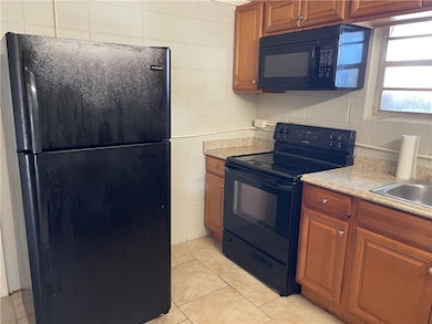 Kitchen has black appliances