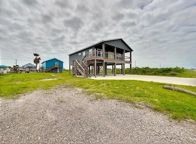 View of front of property featuring stairs, a fro