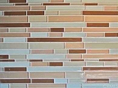 Close up detail of the glass tile back splash.