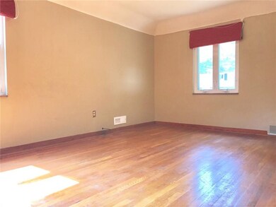 Bedroom with hardwoods